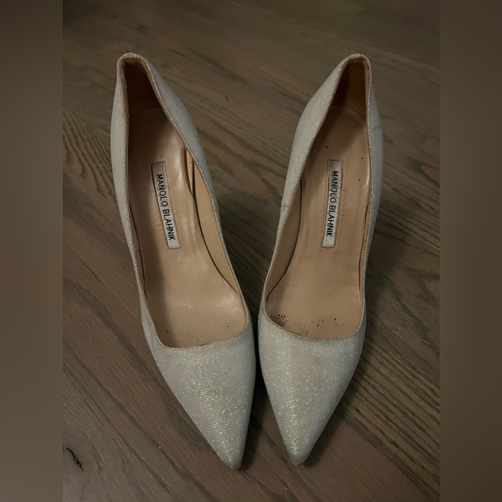 Gently worn Manolo Blanhik silver stilettos.